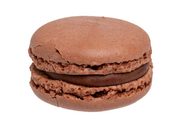 Macaron isolated. Close-up of a single original french brown chocolate macaroon cookies isolated on a white background. Pastries, desserts and sweets. Macro photograph.