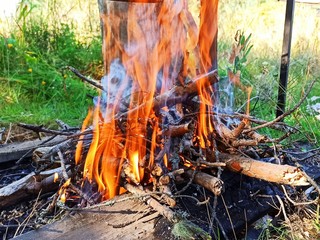 Fire on the background of grass