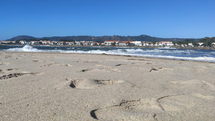 Waves of water of the river and the sea meet each other during high tide and low tide. Whirlpools of the Cavado River in Esposende, Portugal.