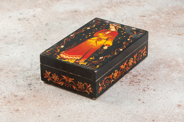 Old wooden box on concrete background.