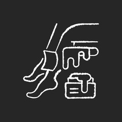 Waxing chalk white icon on black background. Unwanted hair removal. Depilation and epilation. Sugaring procedure. Leg waxing. Cosmetology. Isolated vector chalkboard illustration