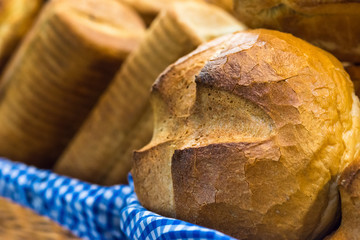 Freshly baked crusty loaves of bread in a basket.