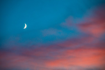 Fototapeta na wymiar Sunset and moon on the beautiful sky