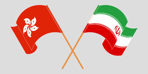 Crossed and waving flags of Iran and Hong Kong