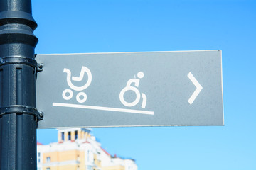 Road sign in the park for the disabled, Information plate for lowering wheelchairs, sign on the...
