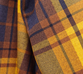 Detailed close up view on samples of cloth and fabrics in different colors found at a fabrics market