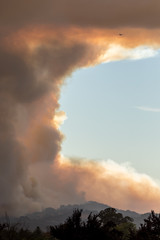 We Will Not Rest - Fire aircraft comes around for another pass as smoke rises aggressively. Santa Rosa, California, USA