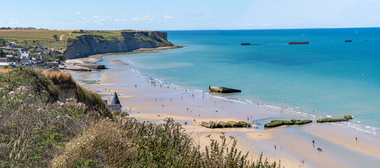 Arromanches, France - 08 04 2020: View of the Landing Beach from the cliffs - obrazy, fototapety, plakaty