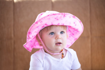 beautiful baby in a pink hat.