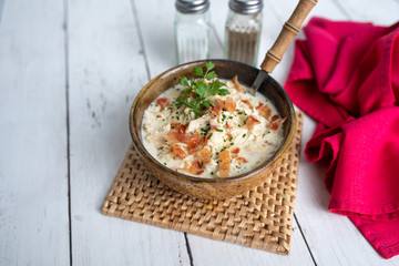 Shredded chicken in cream cheese sauce and bacon cooked in slow cooker