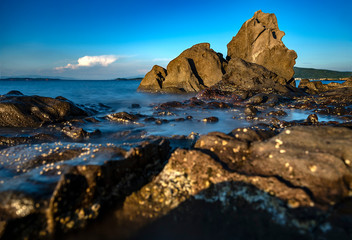 Fototapeta na wymiar Long exposure in the rockery on the beach of Balikliova
