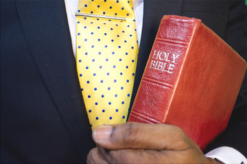Man holding holy bible