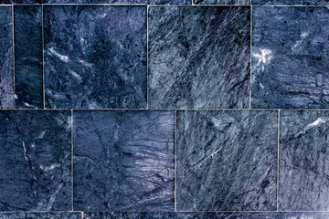 Grunge wall background. Purple marble flooring. Concrete tile texture close-up