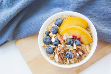 Oatmeal porridge with blueberries. Superfood for healthy nutritious breakfast