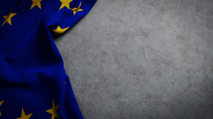 Flag of the European Union on concrete backdrop. EU flag background with copy space