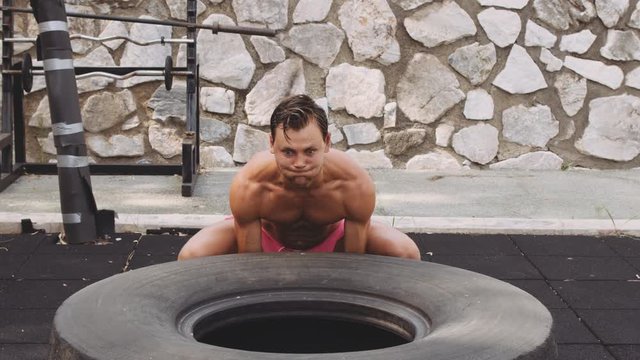 Muscular Man Putting Back Barbell After Last Bench Press Rep