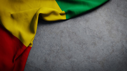 Fototapeta na wymiar Flag of Guinea on concrete backdrop. Guinea flag background with copy space