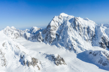Fototapeta na wymiar aerial view of snow covered mountains in alaska