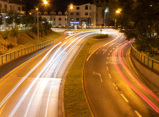 Fototapeta na wymiar Long exposure photo of cars and the road at night
