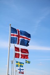 Flags of Sweden Denmark Iceland Finland in the wind