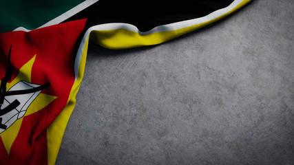 Flag of Mozambique on concrete backdrop. Mozambique flag background with copy space - obrazy, fototapety, plakaty