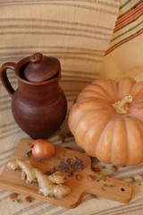 pumpkin with ginger and some vegetables on board close up vegan image