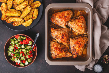 Grilled chicken thighs with spices on table