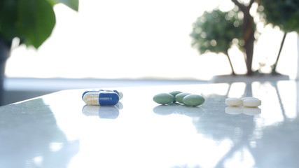 Image with Medical Pills on the Table in a Hospital Room