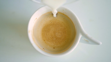 Image with a Cup with Flavored Coffee Mixed with Fresh Milk