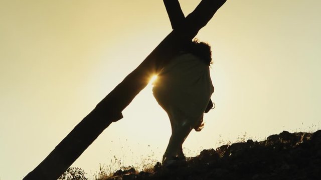 Christ carrying a heavy Cross on Calvary hill - Long Shot