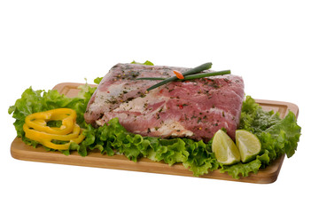 raw pork meat on cutting board on white background