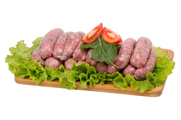 pork sausage with arugula on cutting board on white background