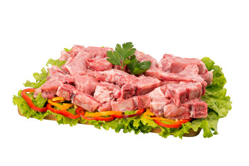 raw pork meat on cutting board on white background