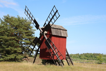 Fototapeta na wymiar Red wood windmill at Öland, Sweden