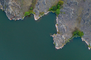 aerial view to curved rock river sides with copy space