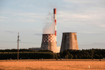 Thermal power plant in the field in summer.