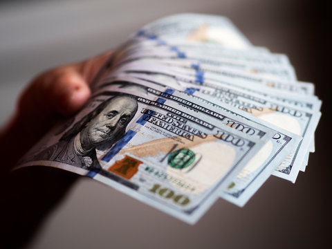  A photo illustration of US 100 dollar bills.