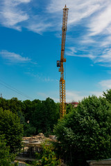 Obraz premium construction crane landmark object vertical picture in clear weather summer day