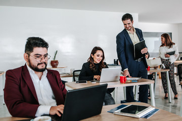 Latin business team working together, mexican people at office or workplace in Mexico