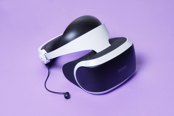 Glasses of virtual reality. Augmented reality, future technology concept. VR. Bright trendy purple background. Free space for text. Top view.