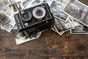 Old Polish post-war photo camera and old black and white photos