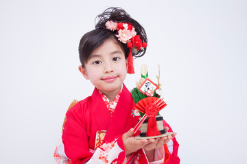 門松と振袖姿の女の子