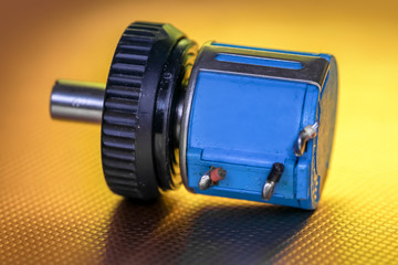 Close up shot of stepper motor on gold background