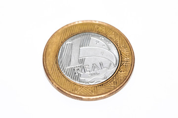 One Brazil real coin on white background.