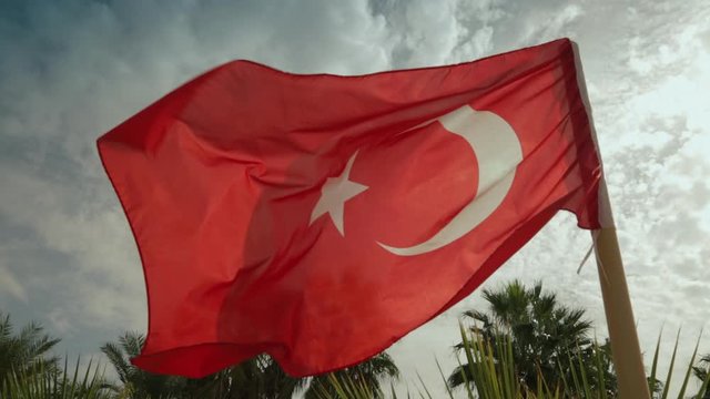 Flag of Turkey blowing in the wind on a sunny day.