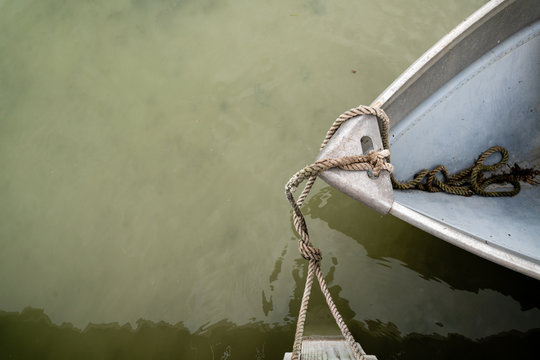 High angle view of a boat tied to a post