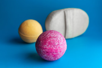 pink and yellow bath bombs and sponge. Natural cosmetics, SPA concept. Copy space.