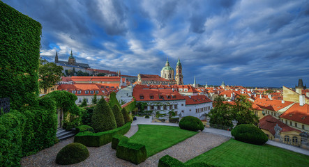 Obraz premium Prague Castle and St Nicholas Church in Lesser Town of Prague. Sunny spring day view from Vrtba Garden. Prague, Czech Republic.