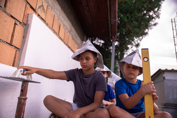 Little boy building a house
