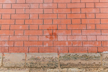 thawed hand mark on a brick wall
